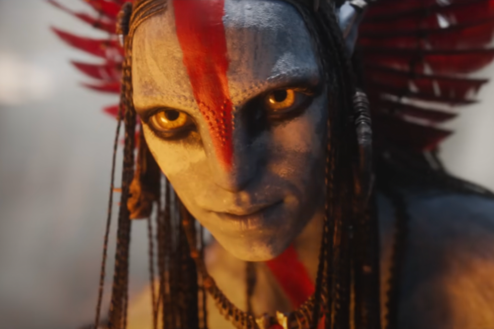 Person with elaborate feathered headdress.